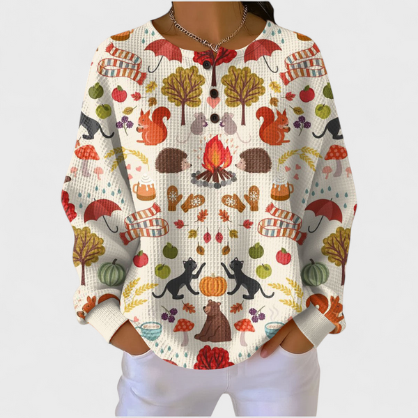 Women's ivory autumn woodland print waffle jumper with trees leaves and seasonal motifs