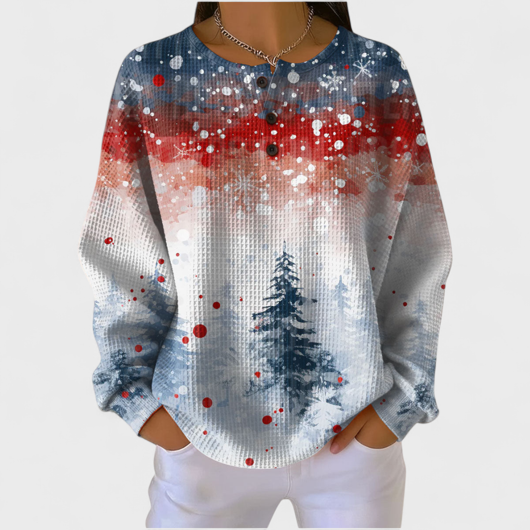 Women's winter forest print waffle jumper with snowy trees and red blue grey tones