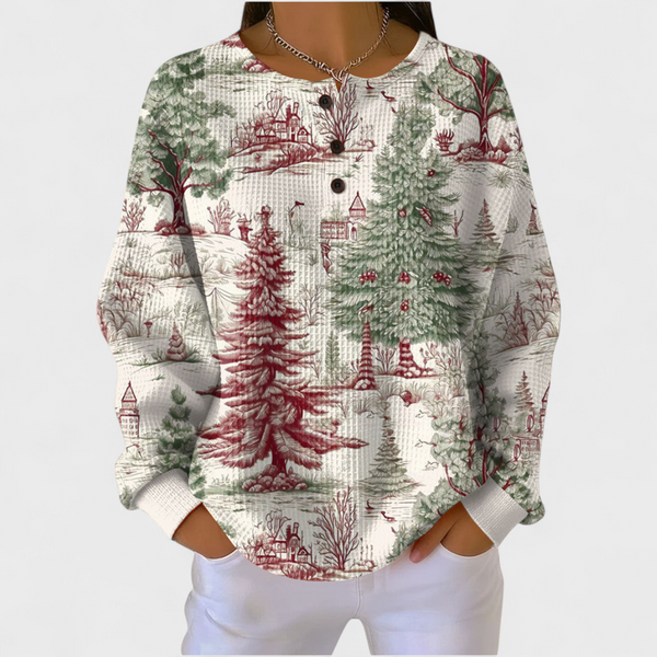 Women's ivory winter landscape waffle jumper with red and green trees and countryside scenes