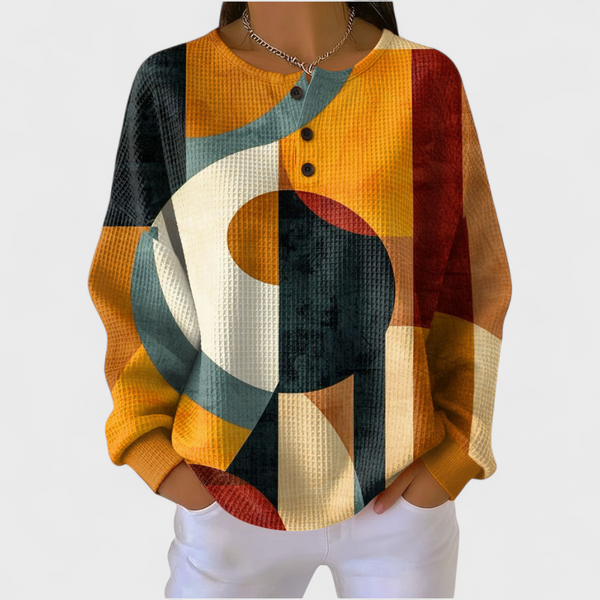 Women's colourful abstract geometric waffle jumper with orange teal cream and dark tones